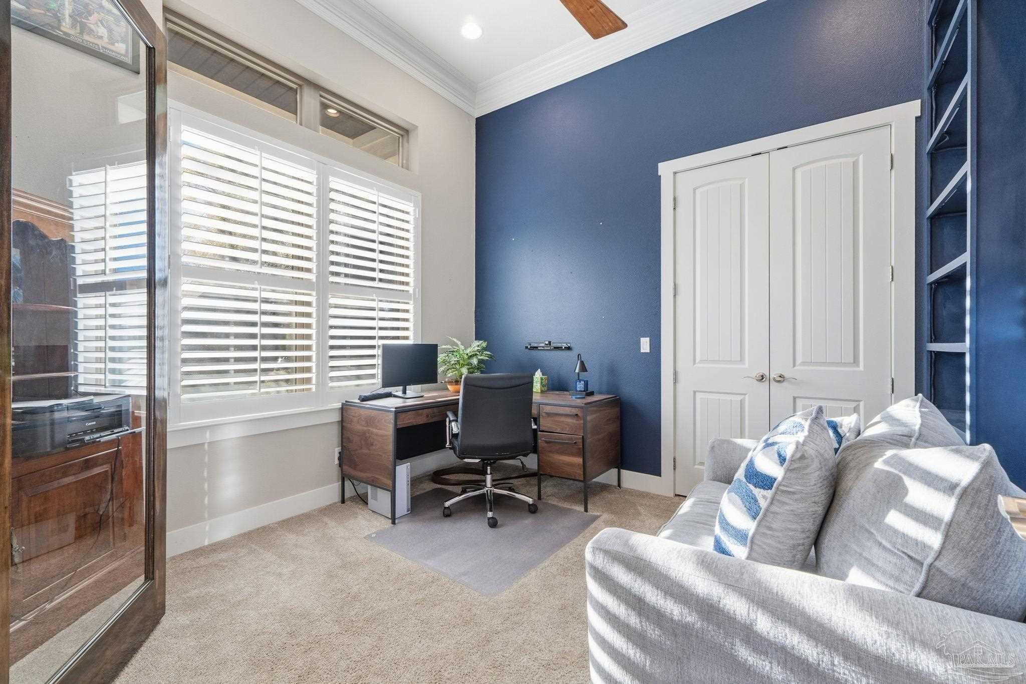 2018 Rambling Oaks Drive Cantonment, FL 32533 - Photo 9 of 64 a bedroom with furniture and a window