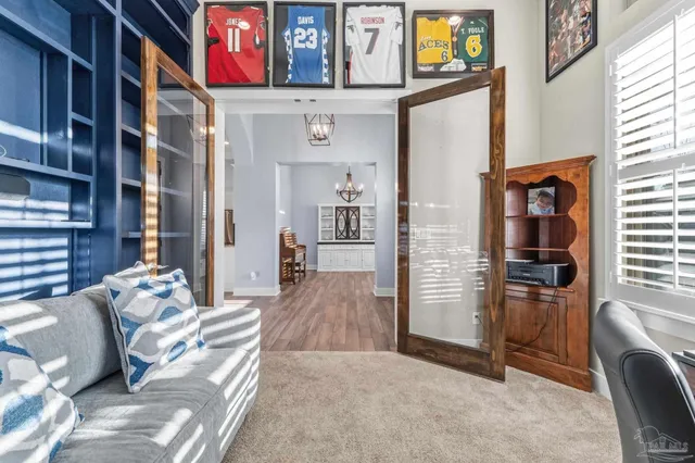 a bedroom with a bed and a desk