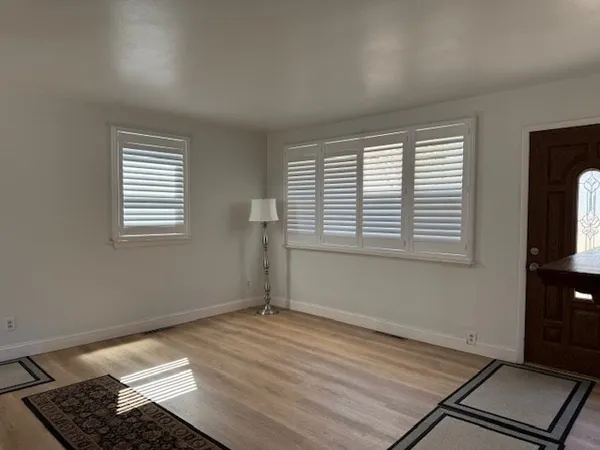 a view of an empty room with a window