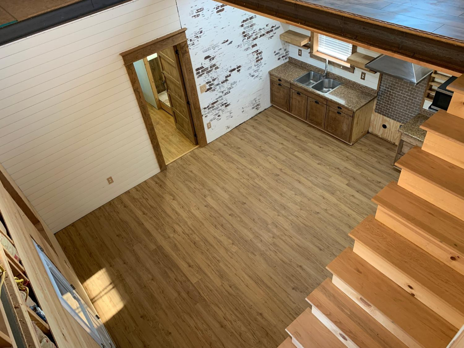 1114 County Road 260 Plains, TX 79355 - Photo 14 of 20 a view of a kitchen with wooden floor