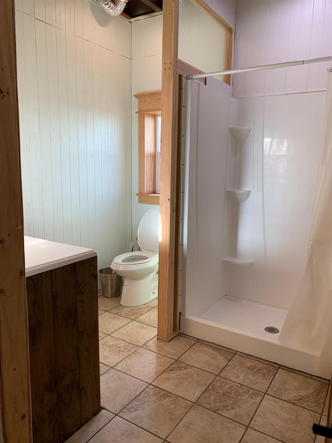 1114 County Road 260 Plains, TX 79355 - Photo 20 of 20 a bathroom with a toilet and a shower