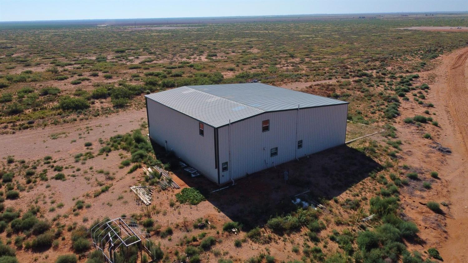 1114 County Road 260 Plains, TX 79355 - Photo 2 of 20 a view of a yard with an ocean