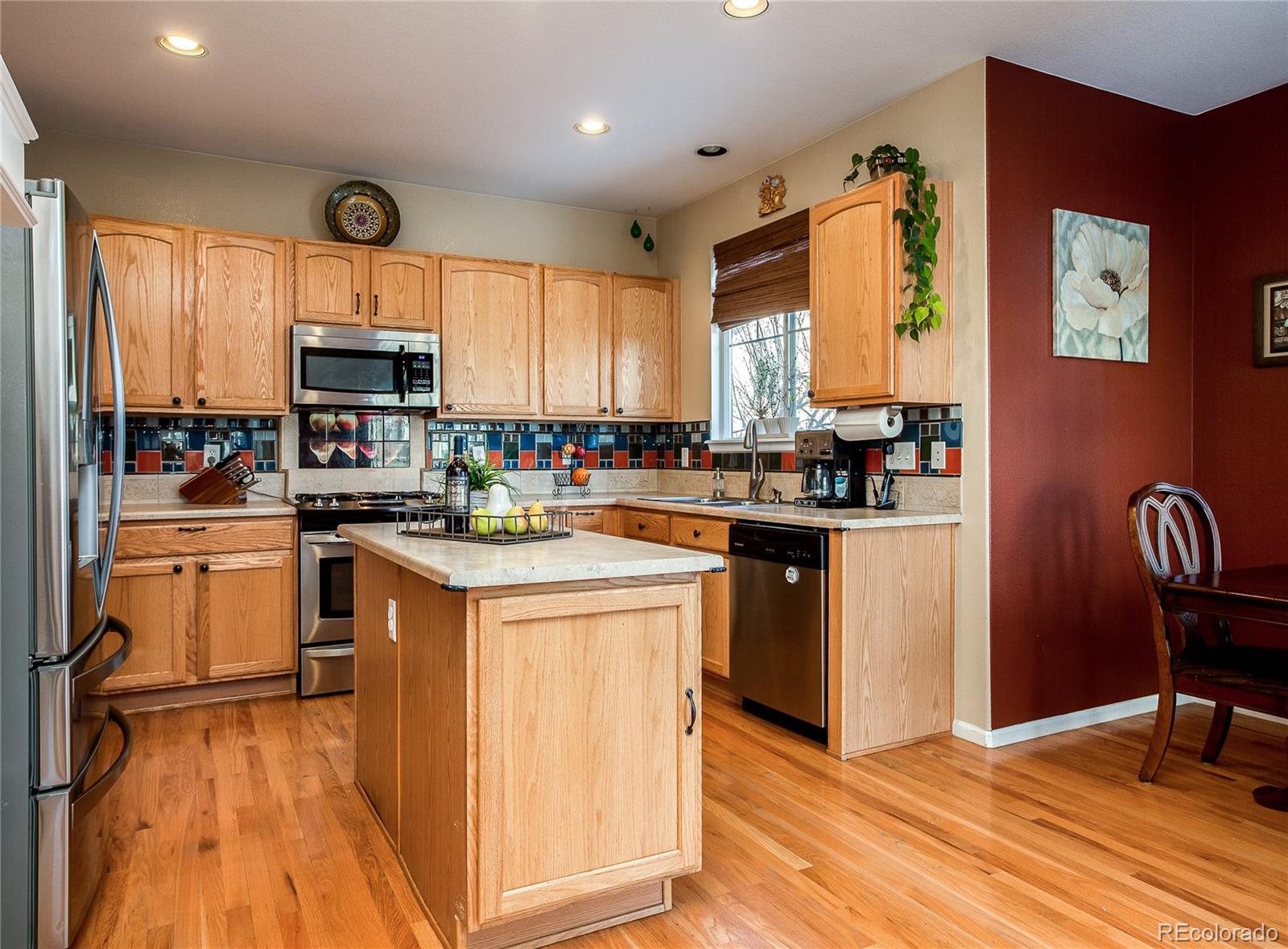 10839 Brooklawn Road Highlands Ranch, CO 80130 - Photo 12 of 32 a kitchen with a sink appliances cabinets and furniture