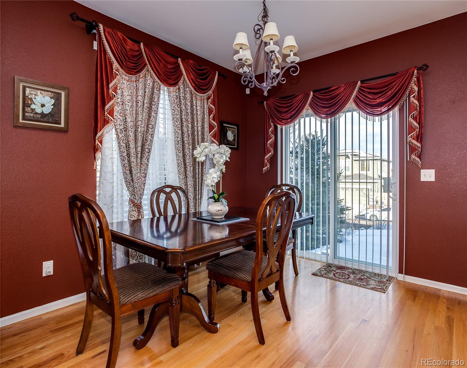 10839 Brooklawn Road Highlands Ranch, CO 80130 - Photo 14 of 32 a view of a dining room with furniture window and wooden floor