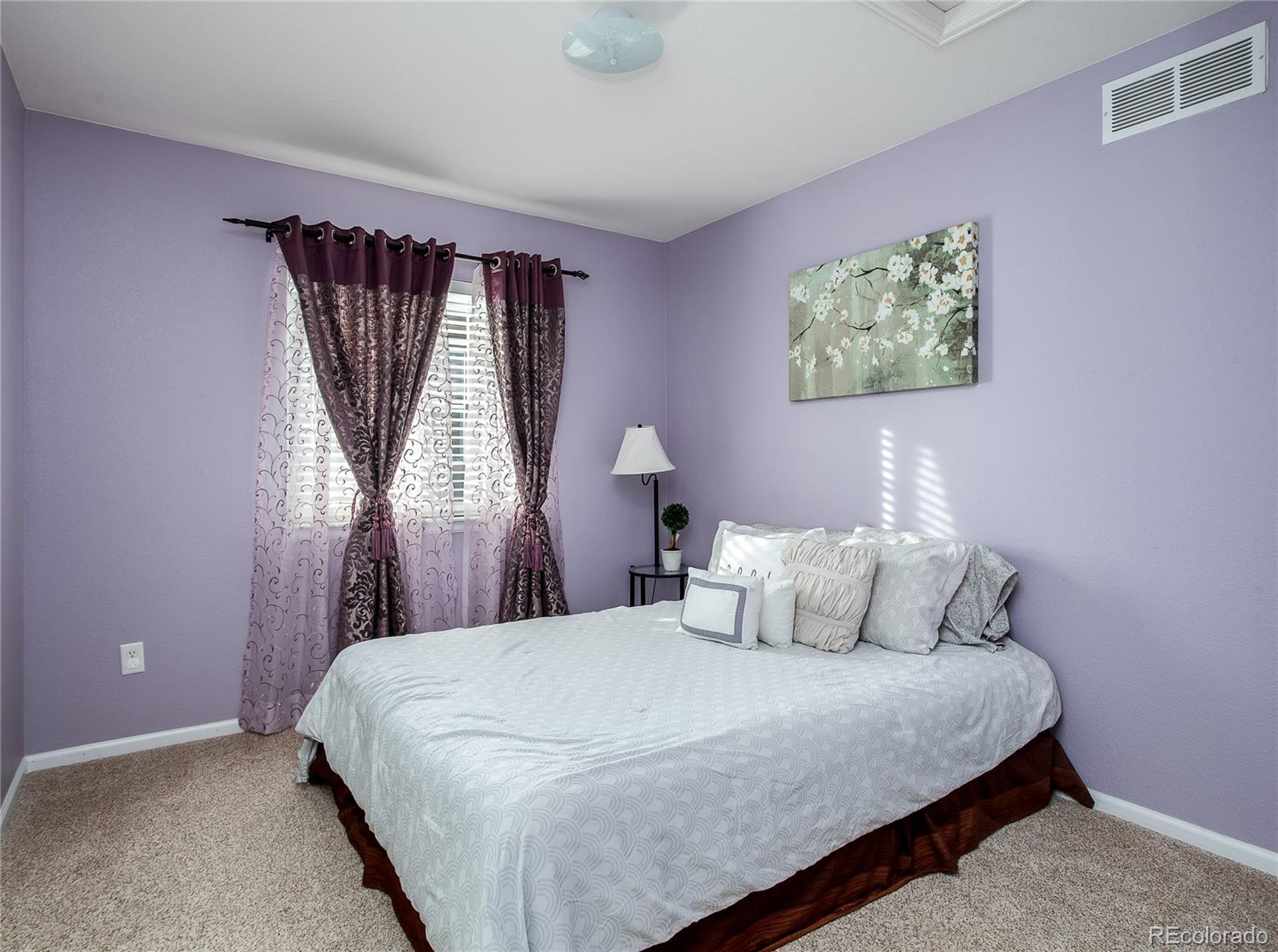 10839 Brooklawn Road Highlands Ranch, CO 80130 - Photo 24 of 32 a bedroom with a bed and a window