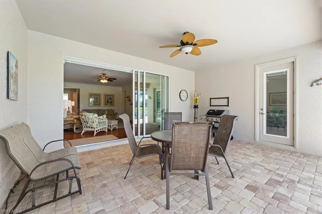 a view of a dining room with furniture and a window