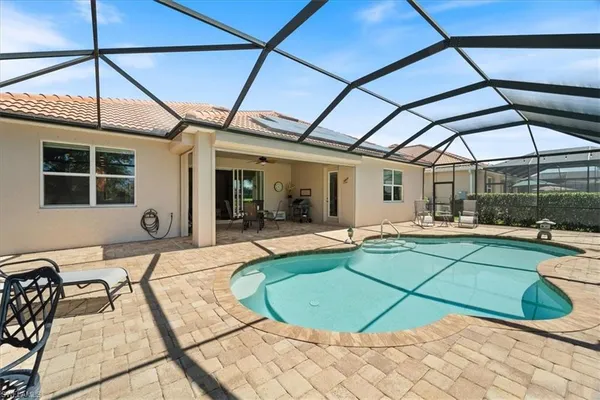 a view of a swimming pool with a patio