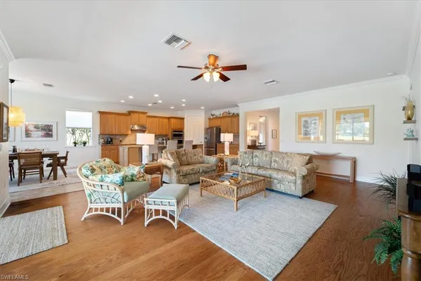 a living room with furniture dining table and a rug