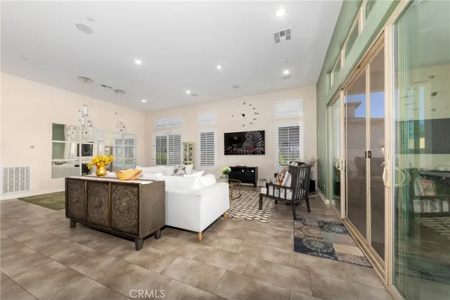 a large kitchen with a table and chairs