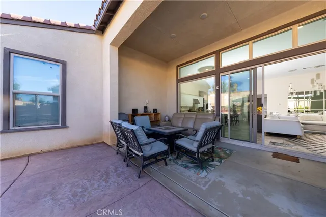 an outdoor space with patio lots of furniture