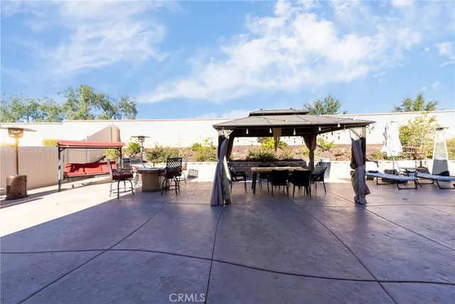 a outdoor dining space with furniture and a garden