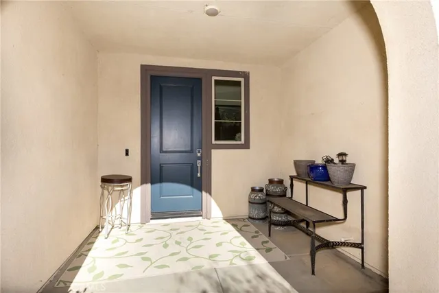 a bedroom with a bed and a chair in it