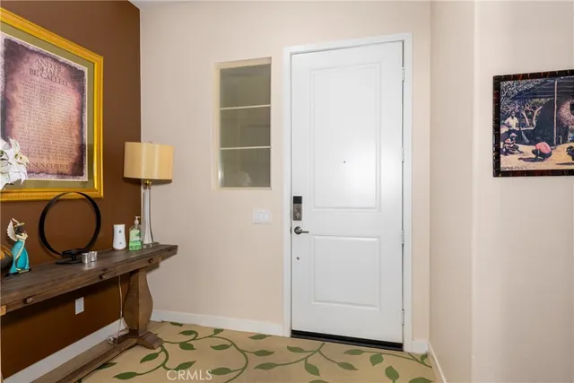 a room with chair and wall paintings