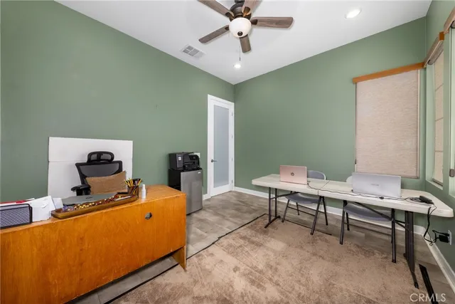 a view of a workspace with furniture