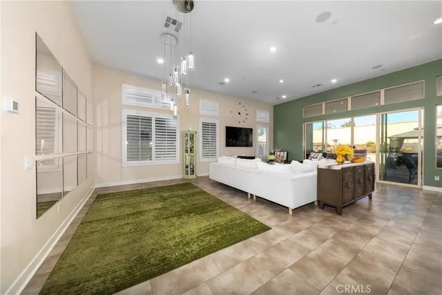 a living room with fireplace furniture and a flat screen tv