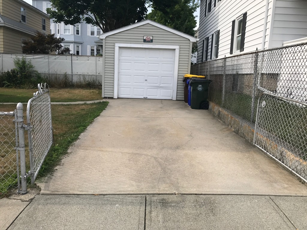 70 Hambly Street Fall River, MA 02721 - Photo 2 of 21 a front view of a house with a garage