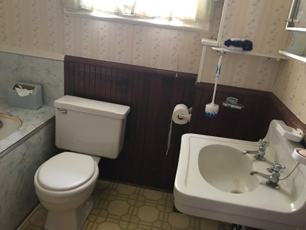 70 Hambly Street Fall River, MA 02721 - Photo 5 of 21 a white toilet sitting next to a bathroom sink