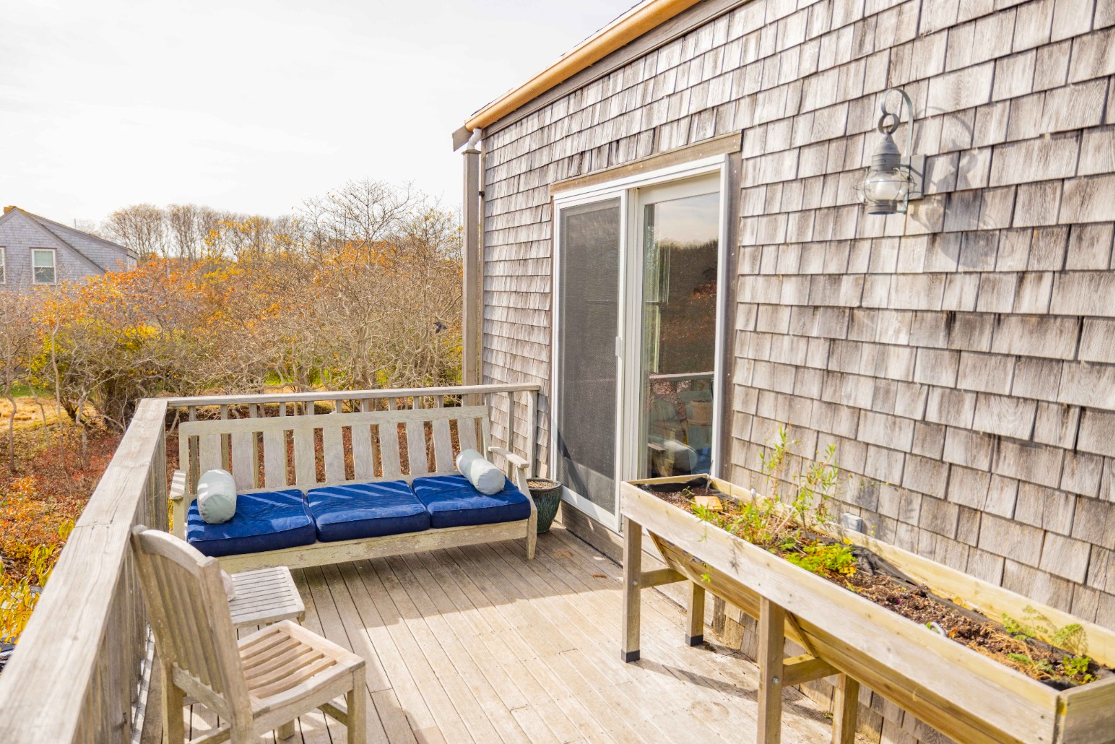 20 Lyons Lane Nantucket, MA 02554 - Photo 11 of 21 a view of a balcony with two chairs and a wooden floor