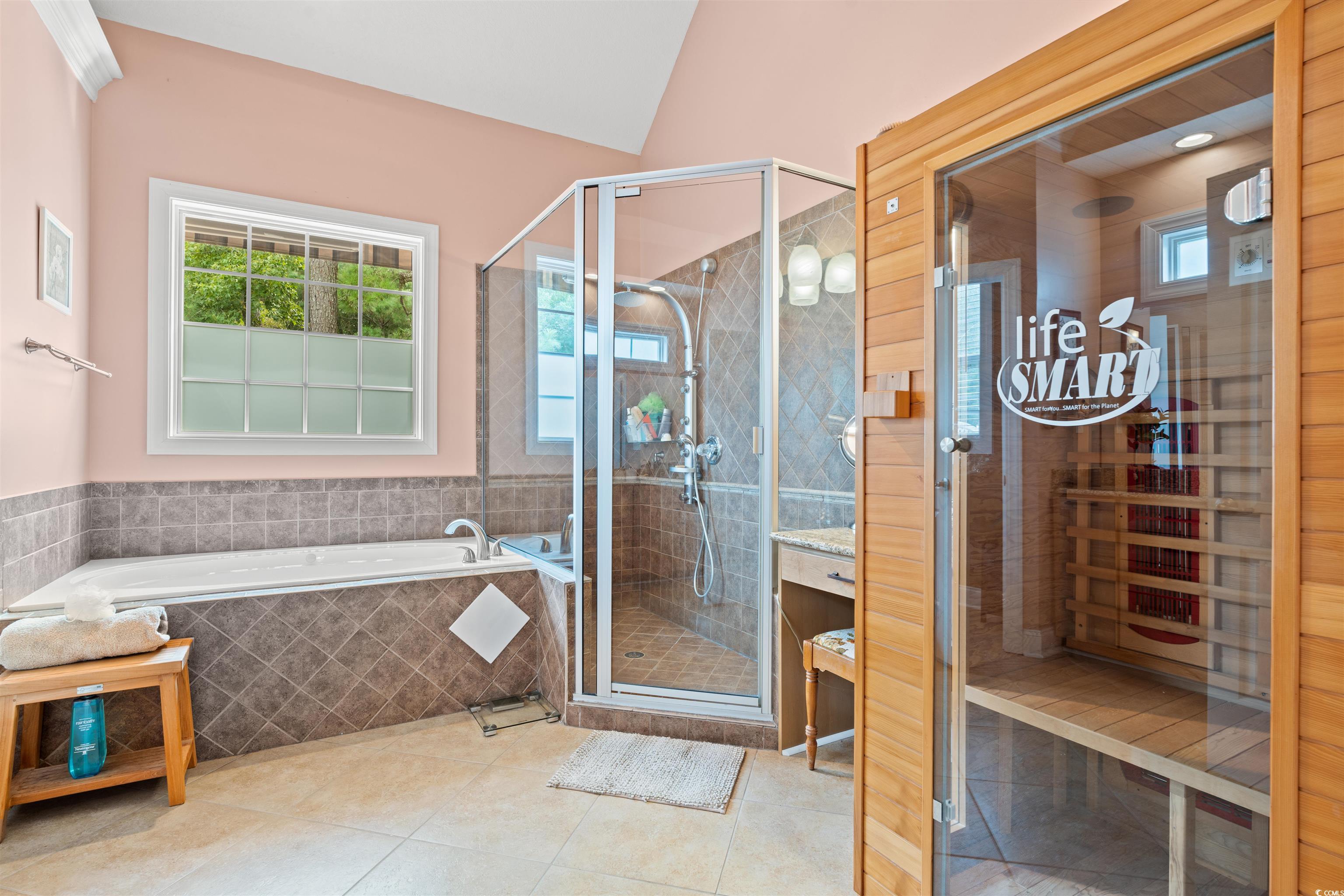 109 Eden Court Murrells Inlet, SC 29576 - Photo 11 of 31 Full bathroom featuring a relaxing sauna, a bath, a stall shower, and light tile patterned floors .