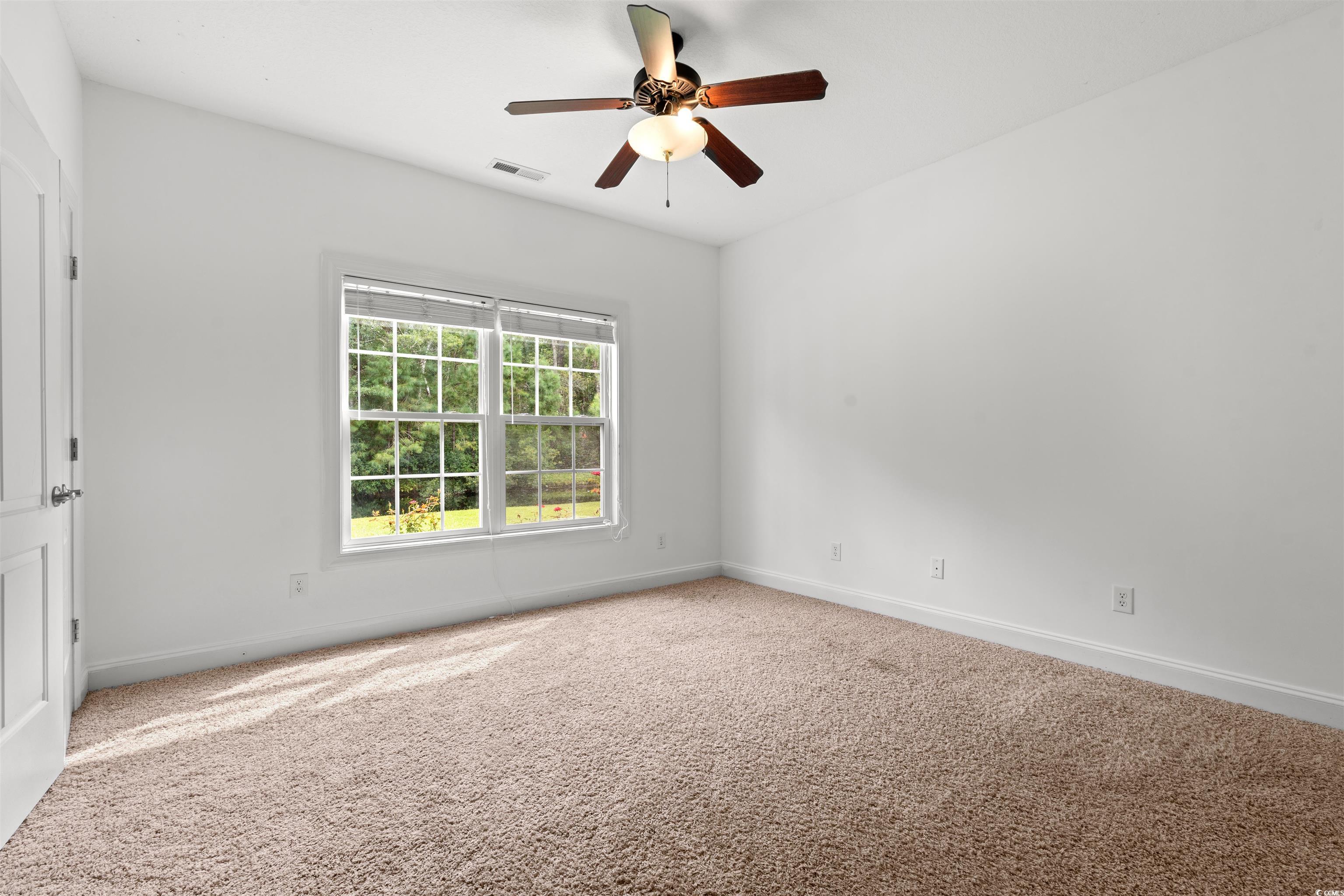 109 Eden Court Murrells Inlet, SC 29576 - Photo 13 of 31 Spare room with carpet and a ceiling fan