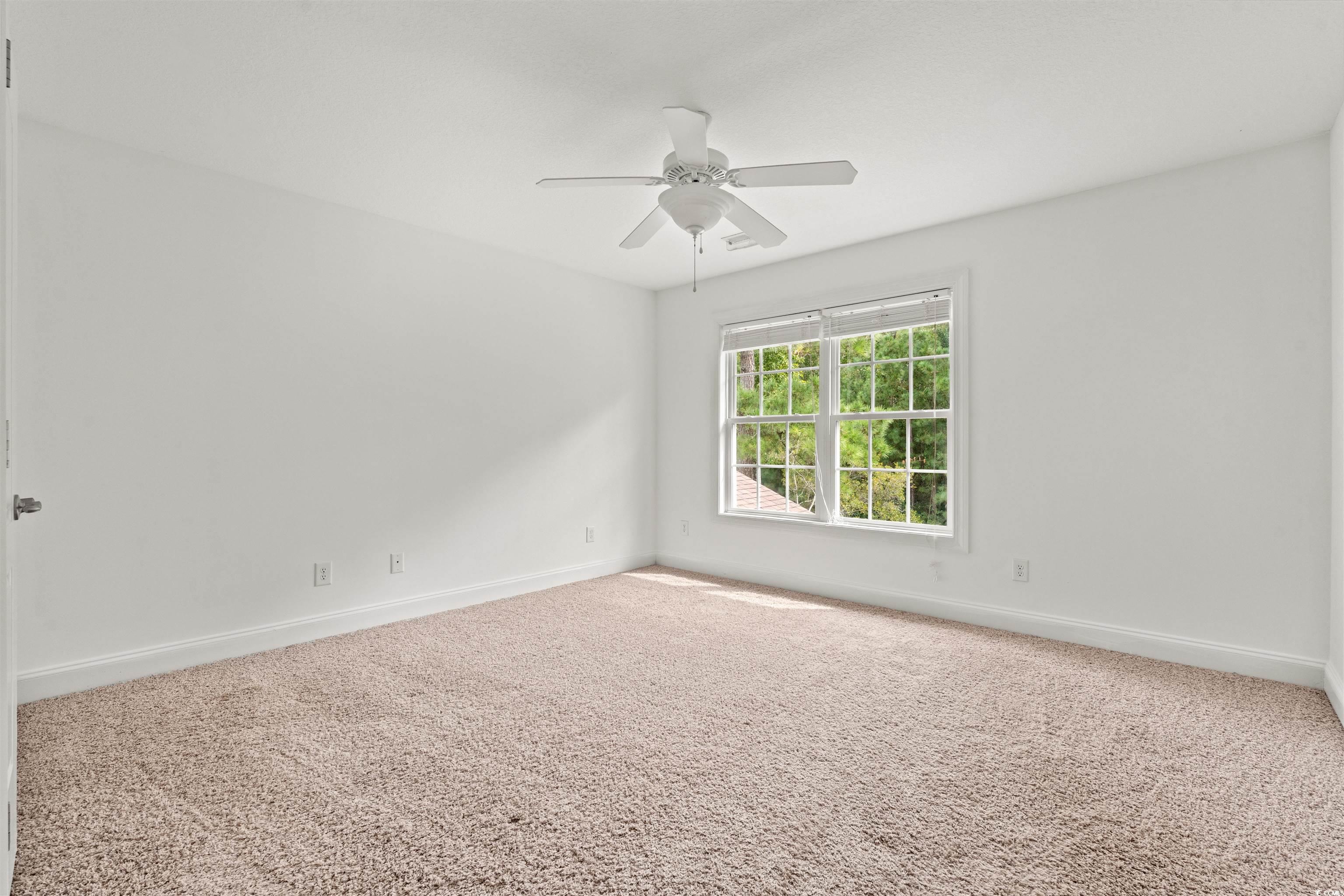 109 Eden Court Murrells Inlet, SC 29576 - Photo 16 of 31 Carpeted empty room featuring baseboards and a ceiling fan