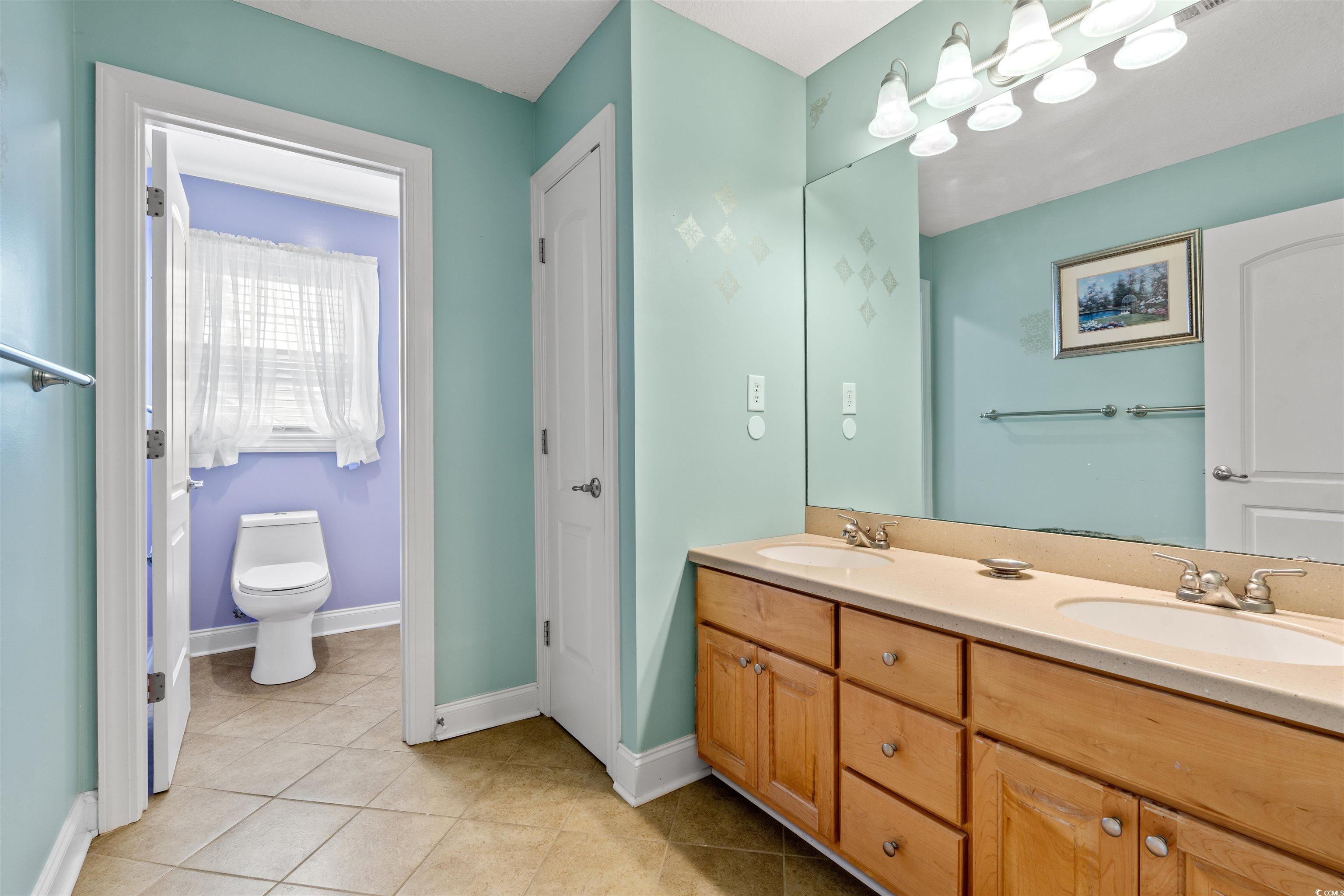 109 Eden Court Murrells Inlet, SC 29576 - Photo 18 of 31 Bathroom featuring light tile patterned floors and double vanity
