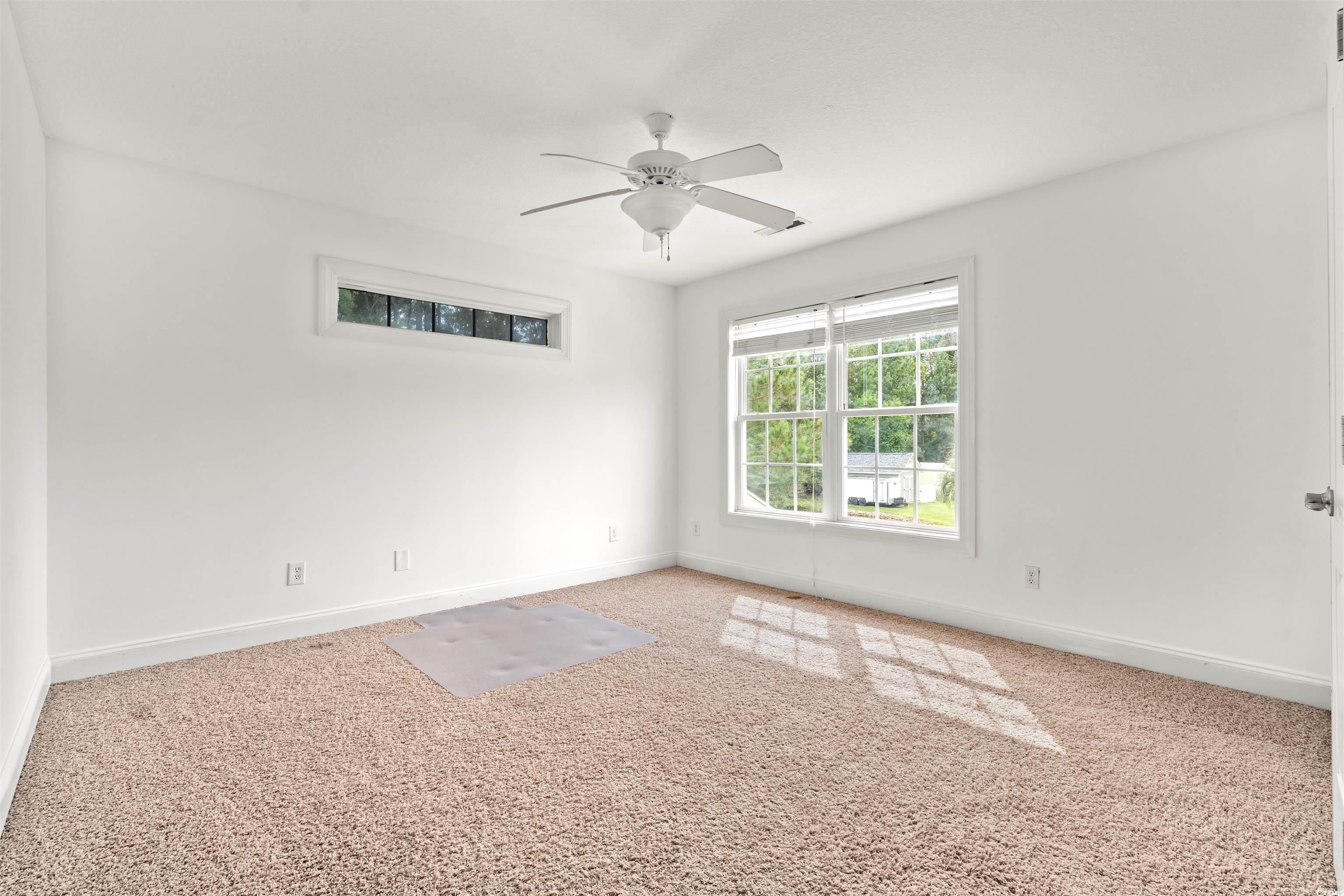 109 Eden Court Murrells Inlet, SC 29576 - Photo 19 of 31 Unfurnished room featuring carpet floors and a ceiling fan