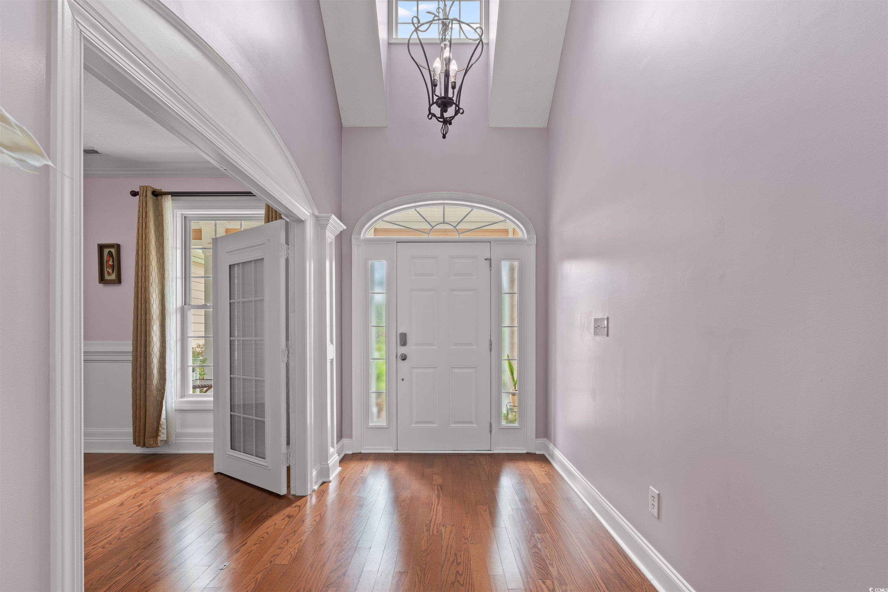 109 Eden Court Murrells Inlet, SC 29576 - Photo 2 of 31 Foyer with hardwood / wood-style floors, a chandelier, and a towering ceiling