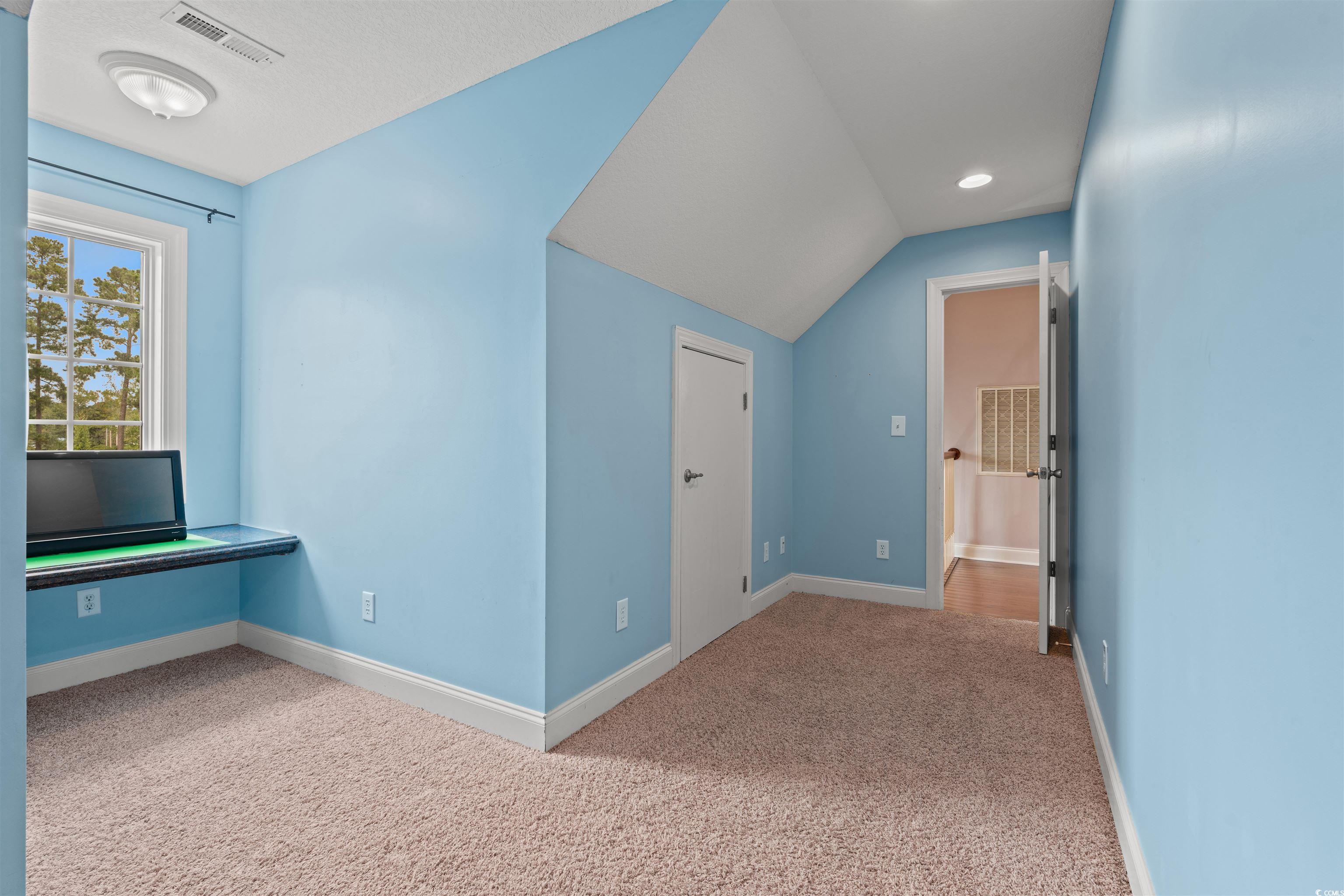109 Eden Court Murrells Inlet, SC 29576 - Photo 21 of 31 Additional living space featuring carpet flooring and lofted ceiling