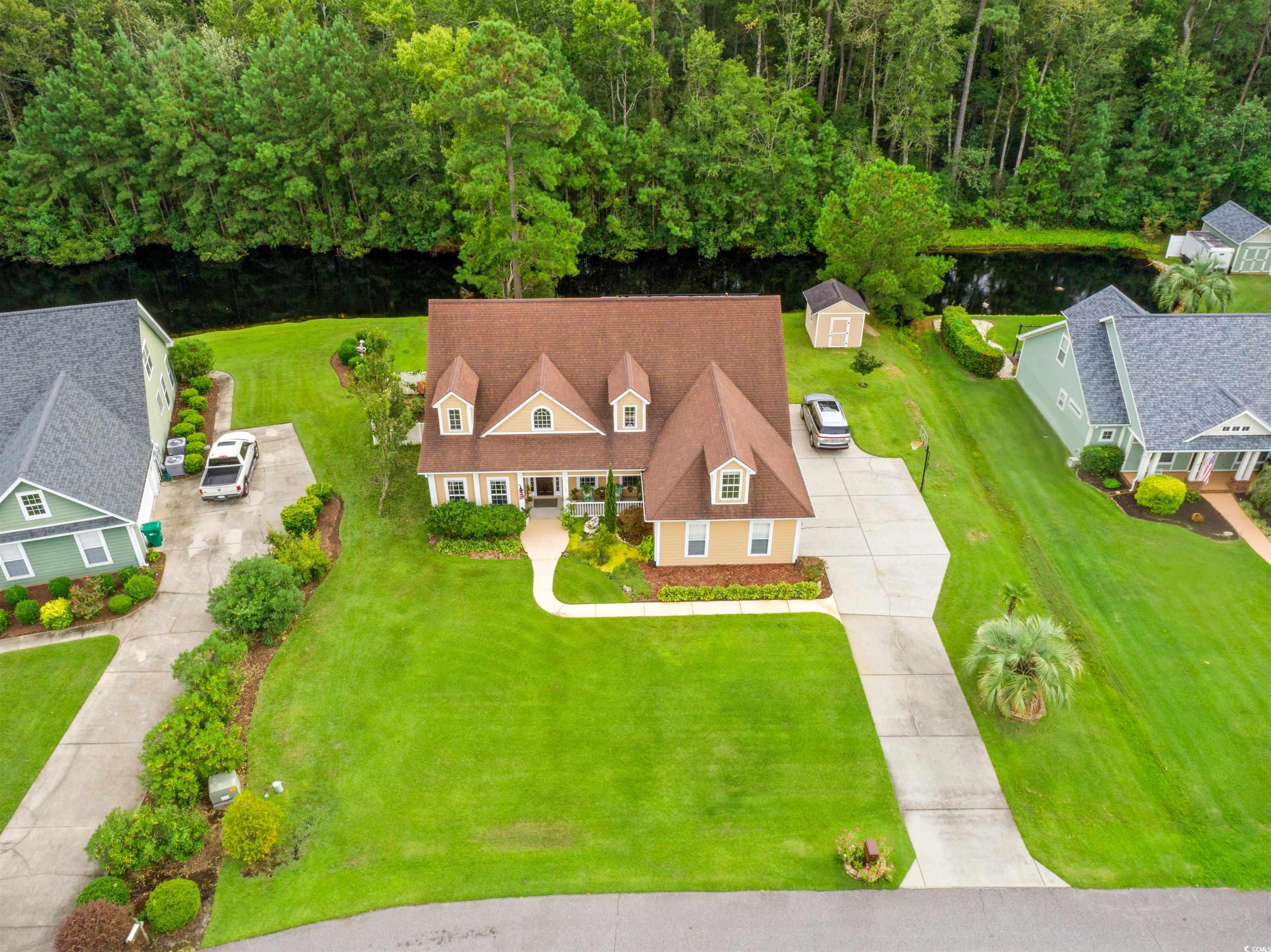 109 Eden Court Murrells Inlet, SC 29576 - Photo 27 of 31 View from above of property with a large body of water