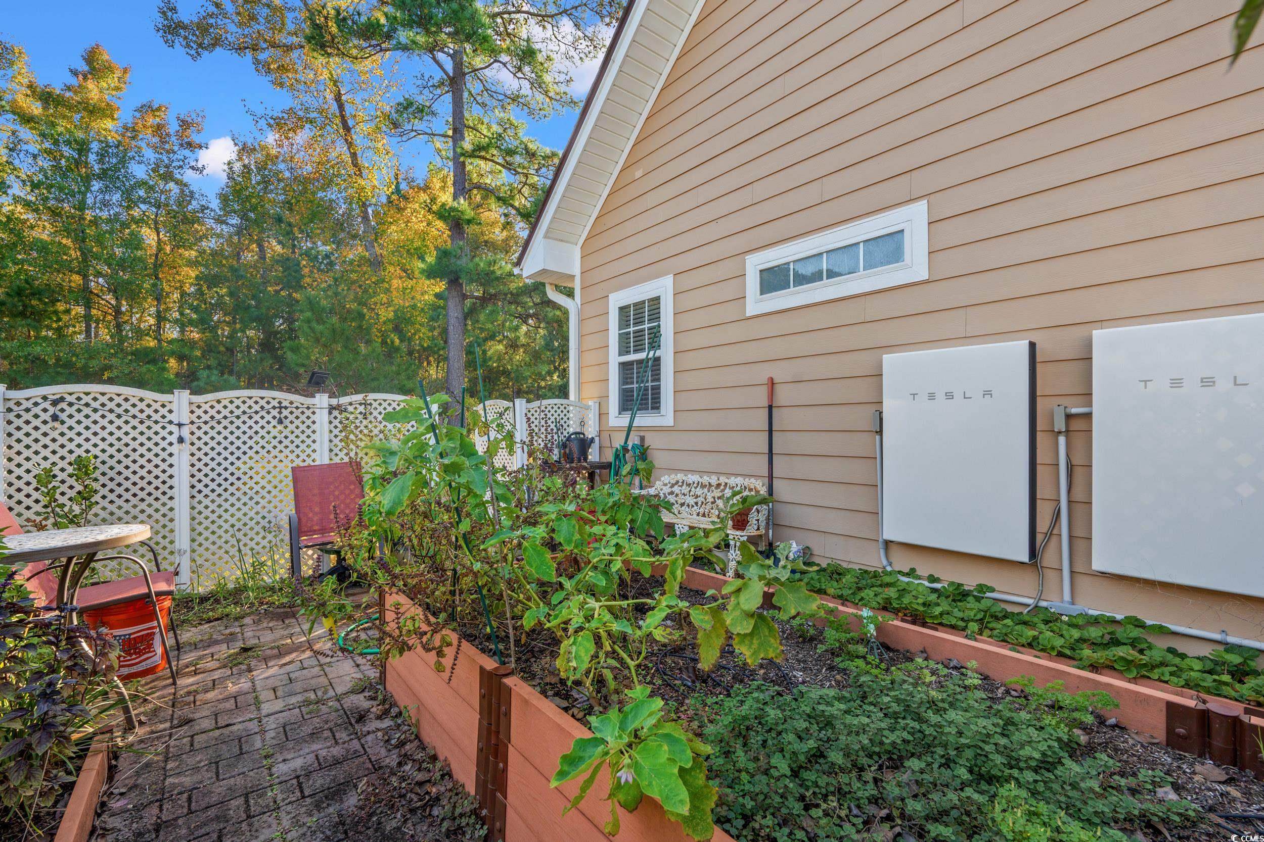 109 Eden Court Murrells Inlet, SC 29576 - Photo 30 of 31 View of home's exterior with a garden