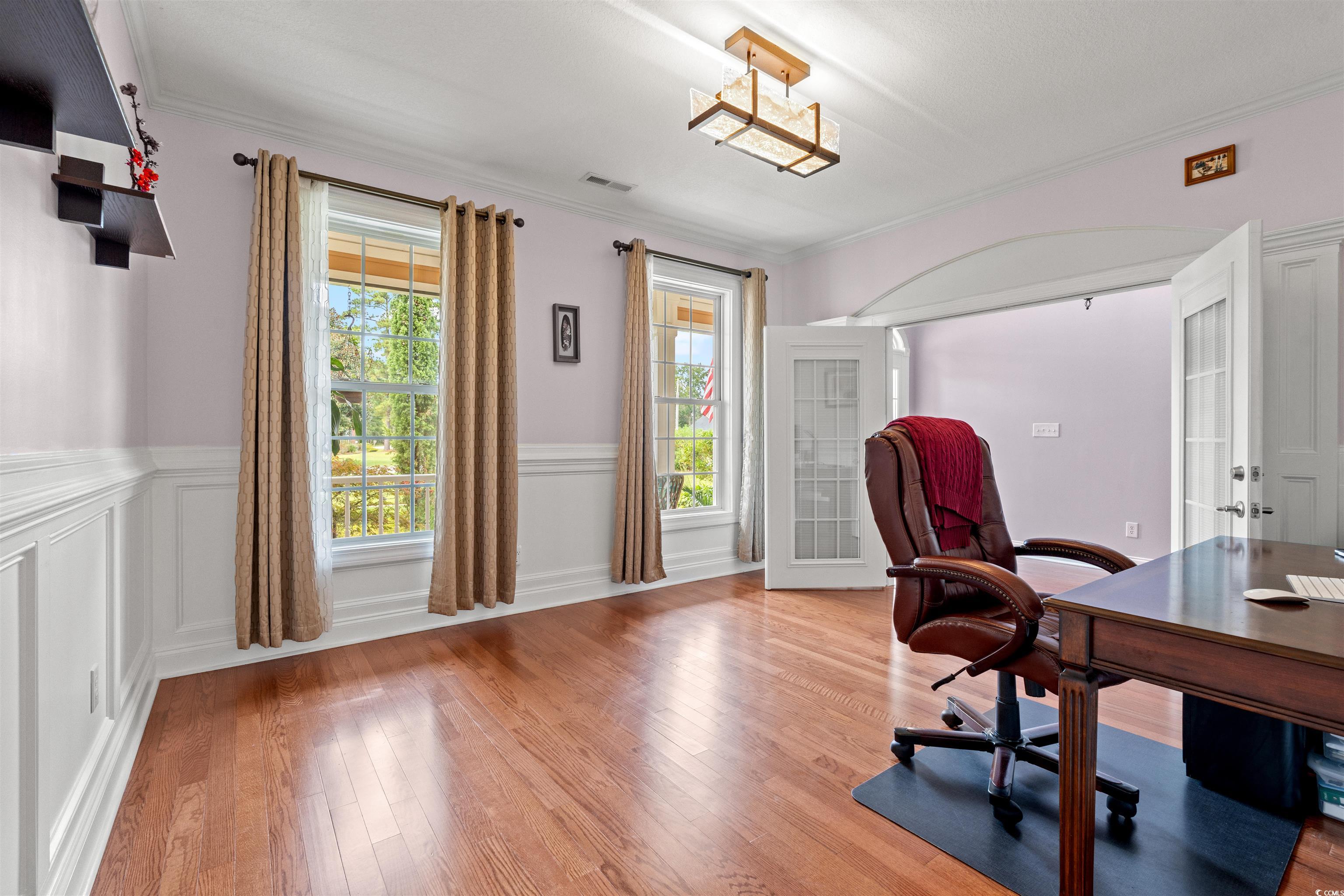 109 Eden Court Murrells Inlet, SC 29576 - Photo 8 of 31 Office space featuring crown molding, wood finished floors, wainscoting, and a decorative wall