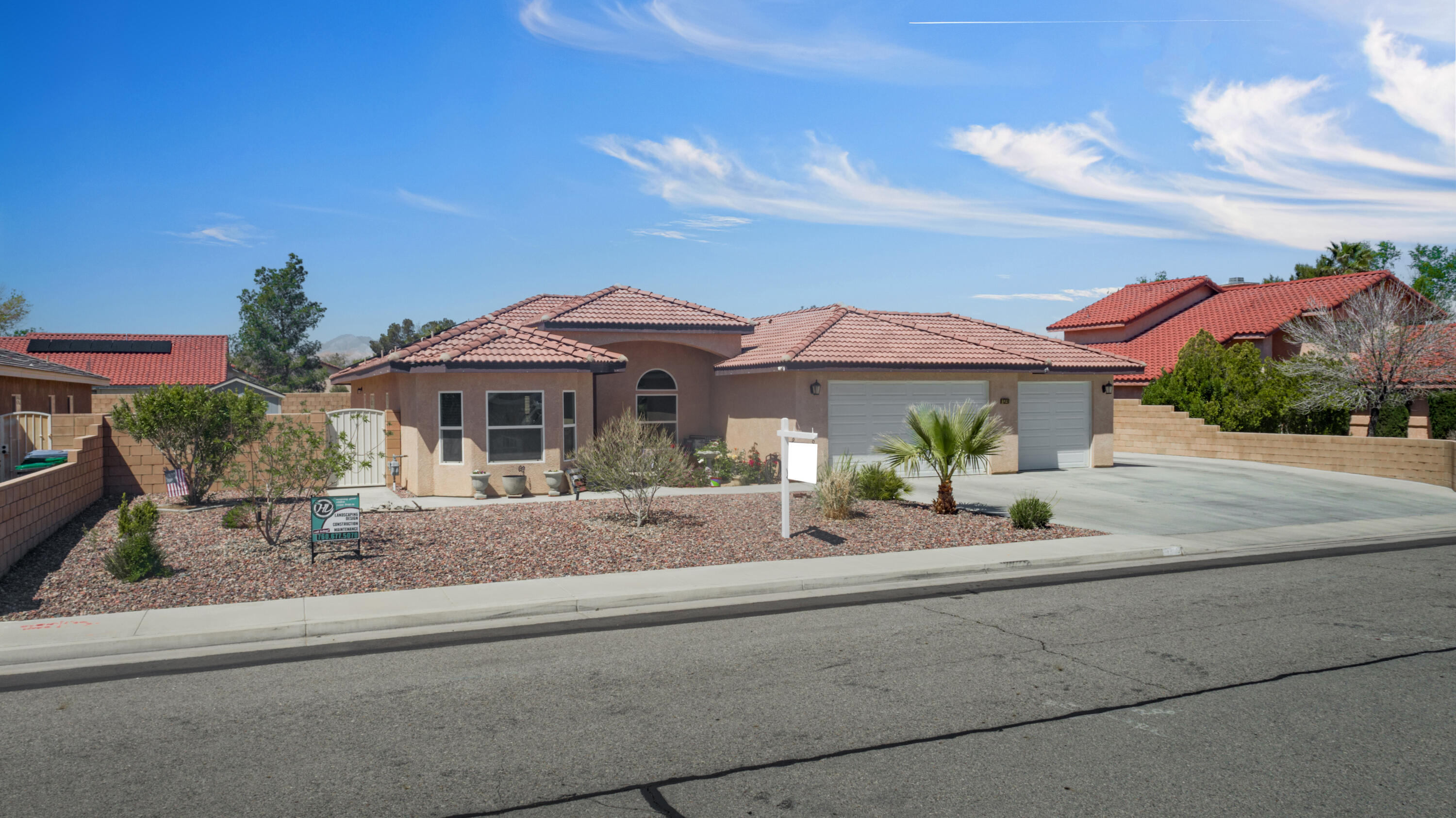 1231 Carolyn Street Ridgecrest, CA 93555 - Photo 1 of 49 a front view of a house with a yard and garage