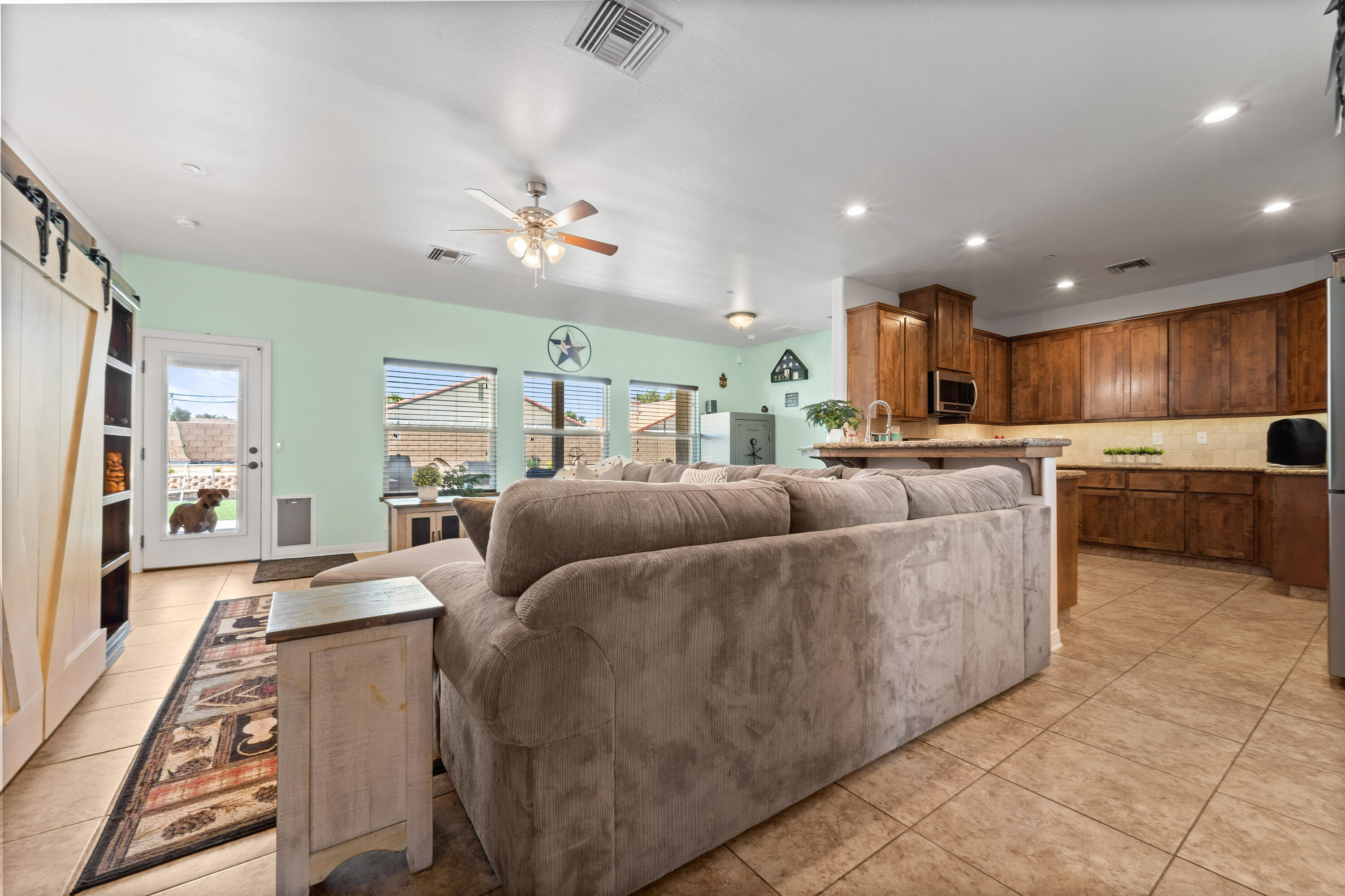 1231 Carolyn Street Ridgecrest, CA 93555 - Photo 13 of 49 a living room with furniture and a chandelier