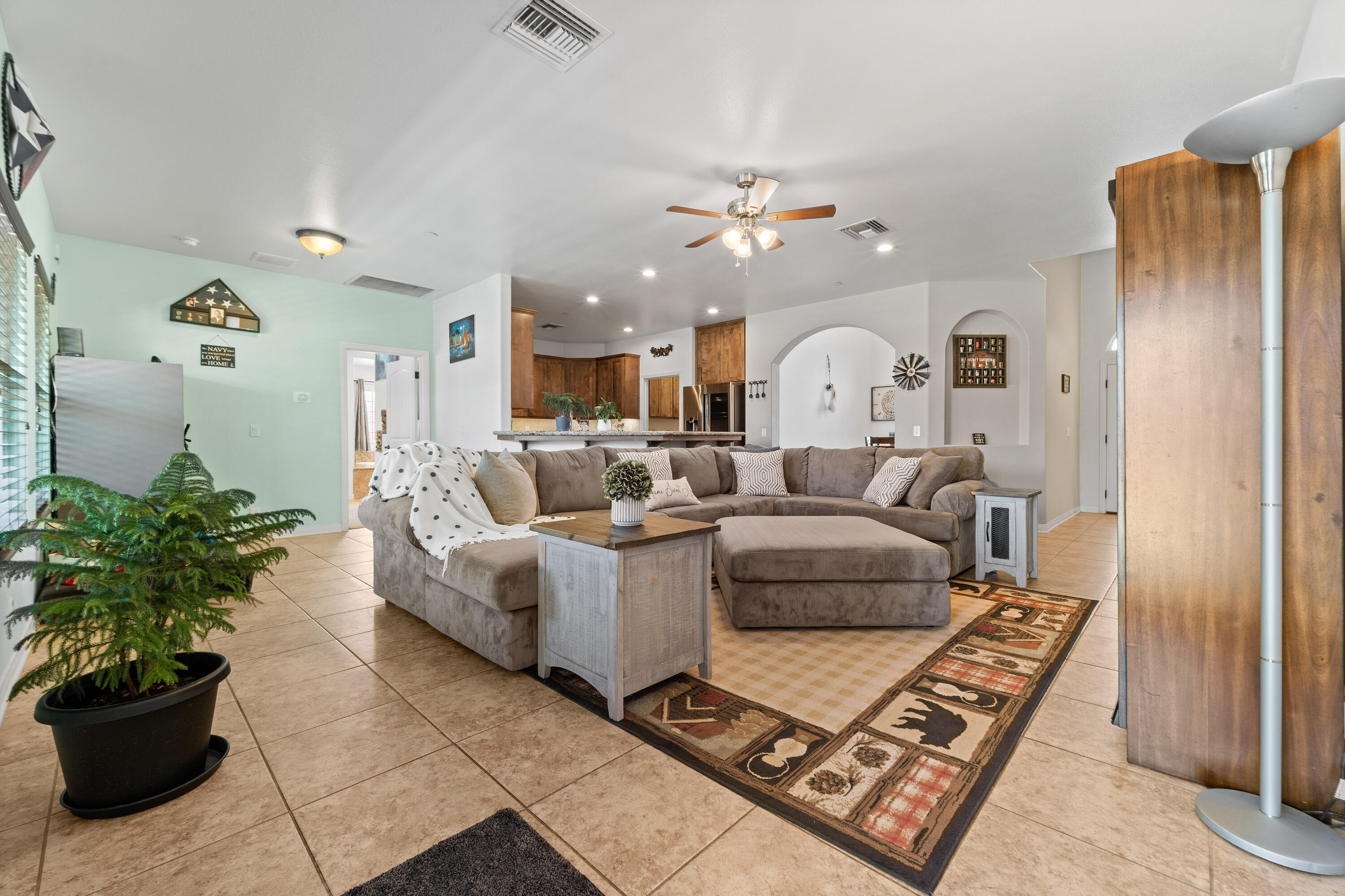 1231 Carolyn Street Ridgecrest, CA 93555 - Photo 14 of 49 a living room with furniture flowerpot and a chandelier