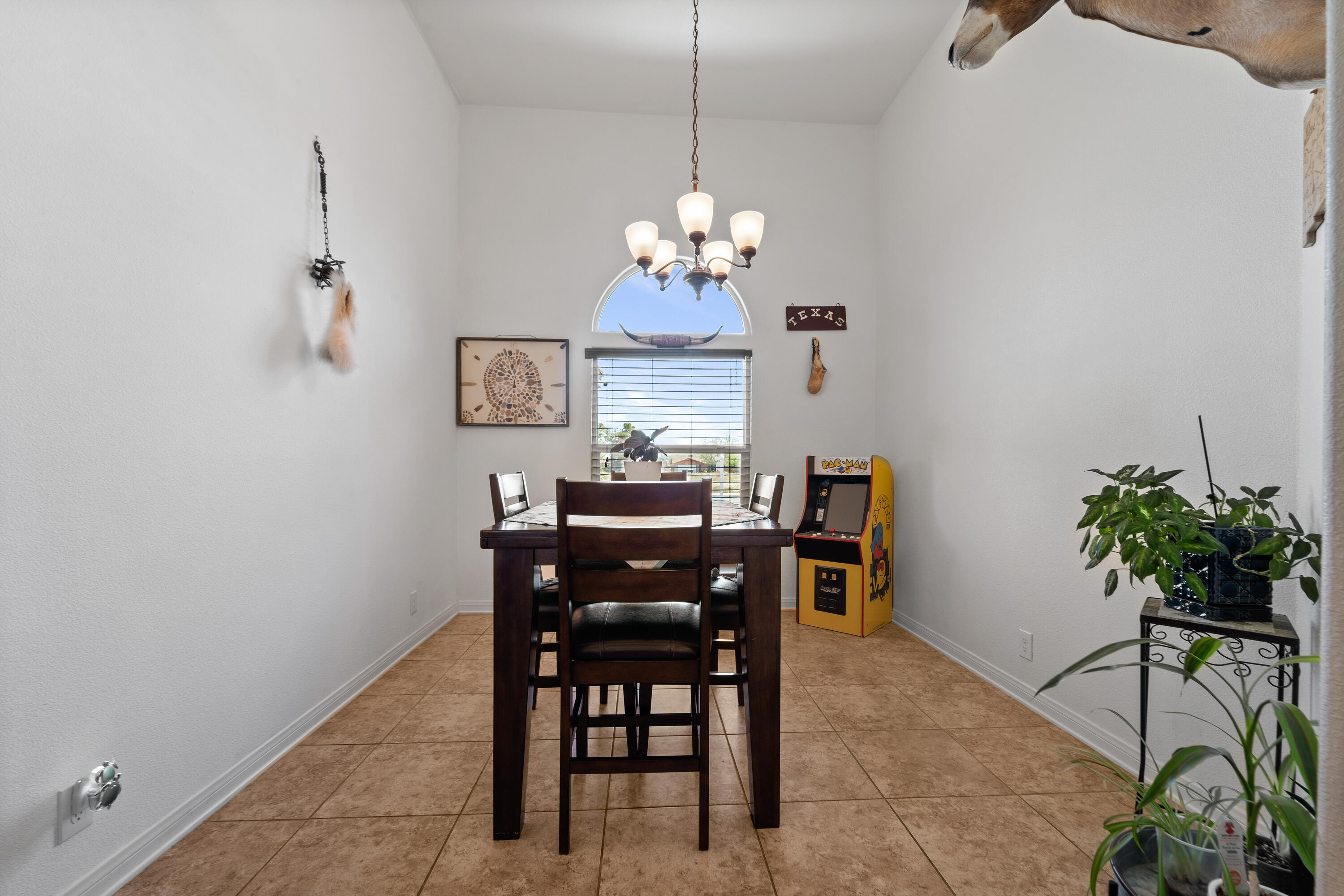 1231 Carolyn Street Ridgecrest, CA 93555 - Photo 20 of 49 a view of a dining room with furniture and chandelier