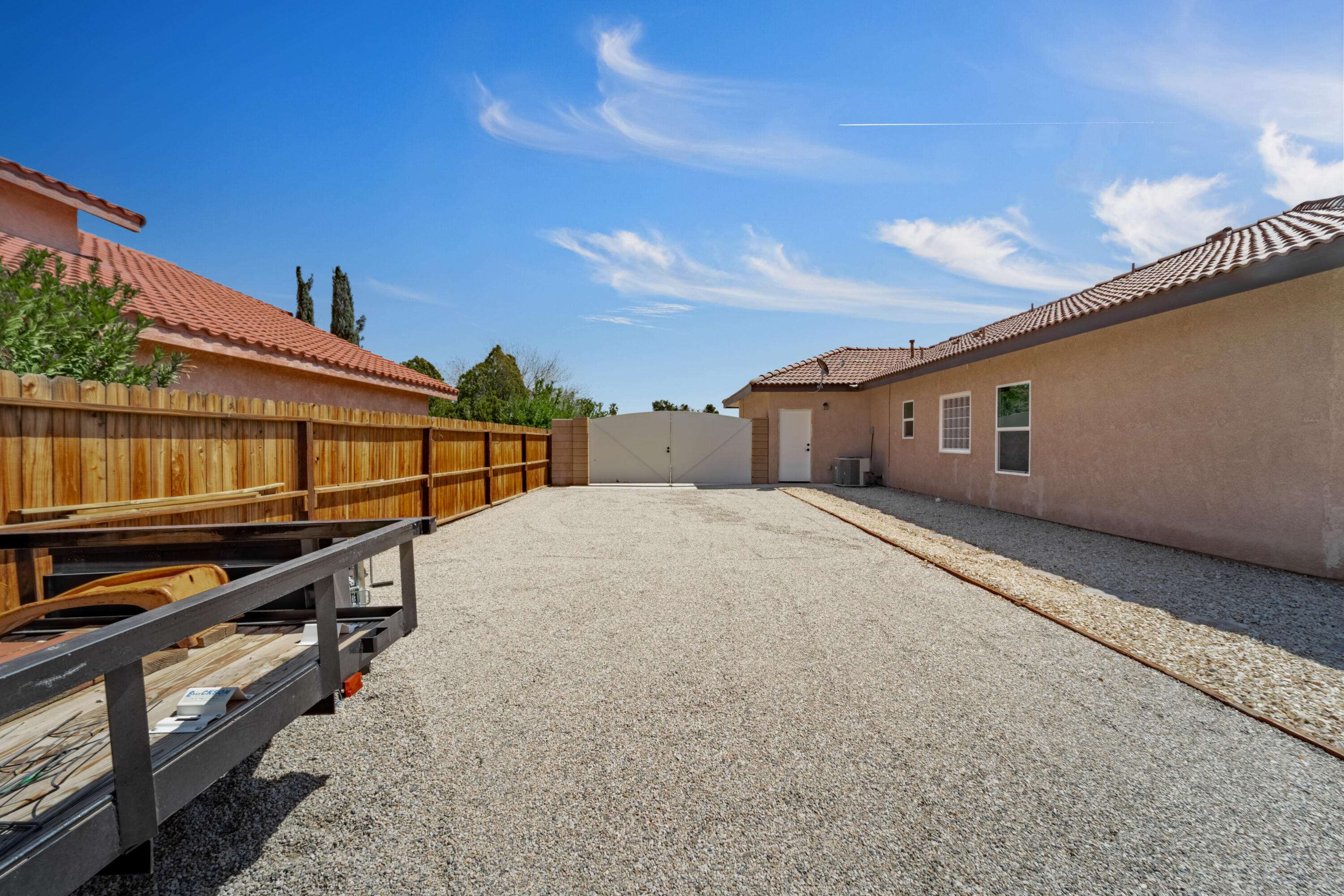 1231 Carolyn Street Ridgecrest, CA 93555 - Photo 41 of 49 a view of a house with wooden fence