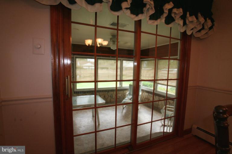 183 Roland Road Pasadena, MD 21122 - Photo 8 of 29 Updated French doors to sunroom