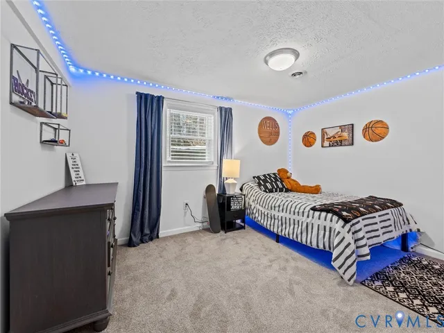 a bedroom with bed and a window