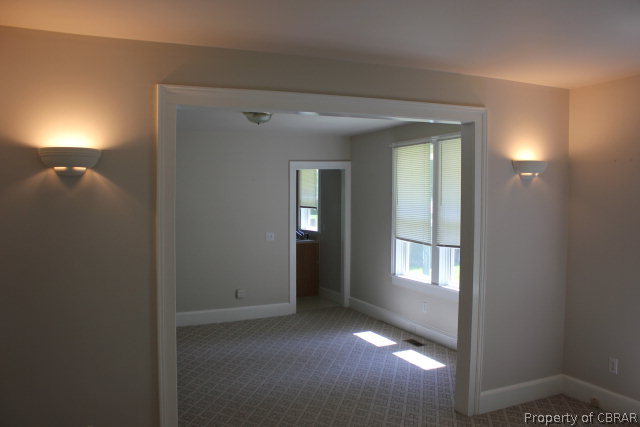 1239 Tabernacle Road Mathews, VA 23109 - Photo 5 of 22 a view of empty room with window