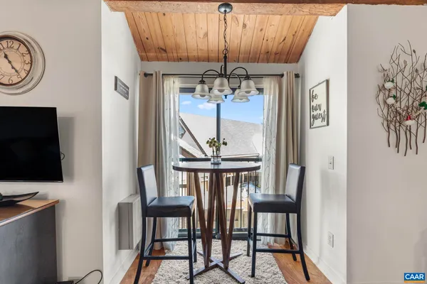a view of entryway livingroom and hall with wooden floor