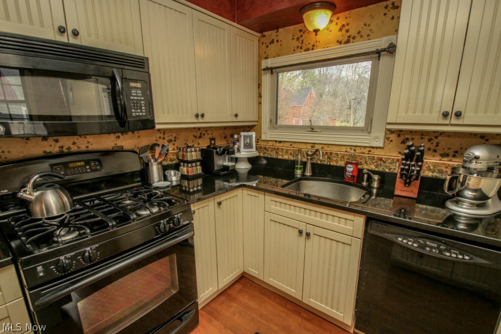 6411 Chestnut Road Independence, OH 44131 - Photo 7 of 25 Kitchen with Updated Cabinetry and Granite Tops