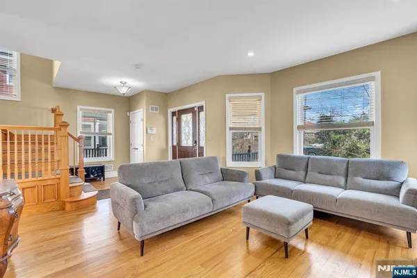a living room with furniture and a large window
