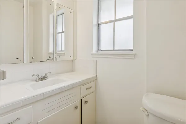 a bathroom with a sink and a toilet