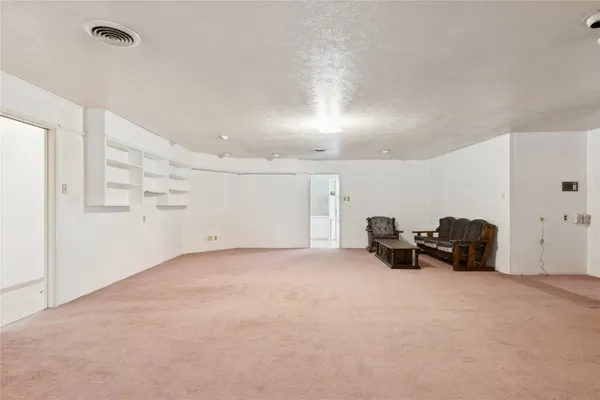 an empty room with furniture