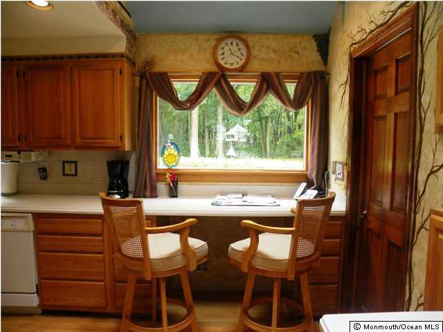 24 Pepperridge Road Howell, NJ 07731 - Photo 3 of 3 a kitchen with a table and chairs in it