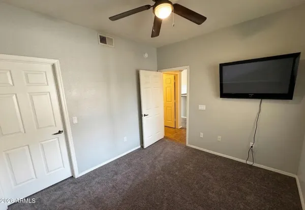 a view of a livingroom with a flat screen tv