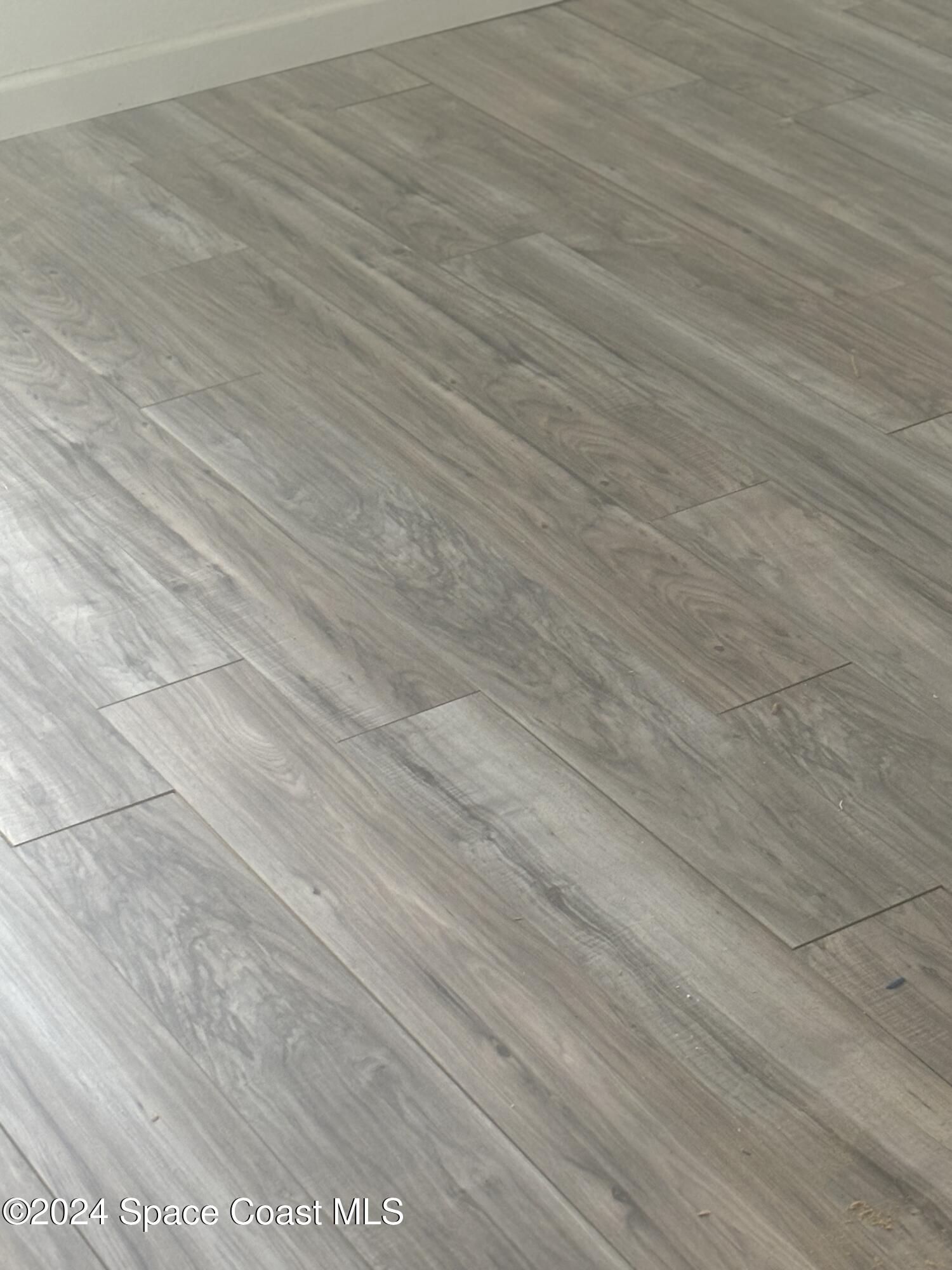 276 Timber Run Way Cocoa, FL 32926 - Photo 13 of 18 an empty room with wooden floor