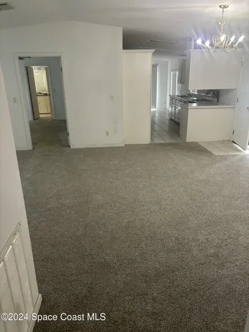 a view of a wooden house with a sign board