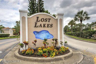 276 Timber Run Way Cocoa, FL 32926 - Photo 8 of 18 a view of a wooden house with a sign board
